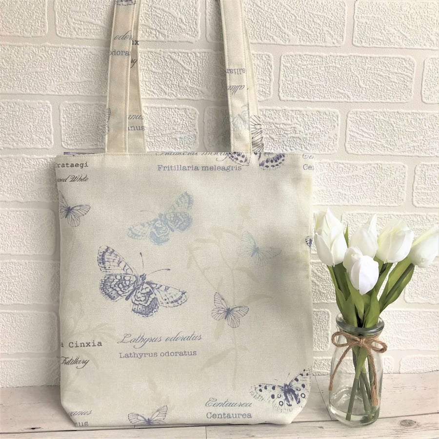 Butterflies tote bag in cream with blue butterflies