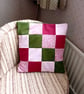 Patchwork cushion cover in olive green, crimson and pink. 