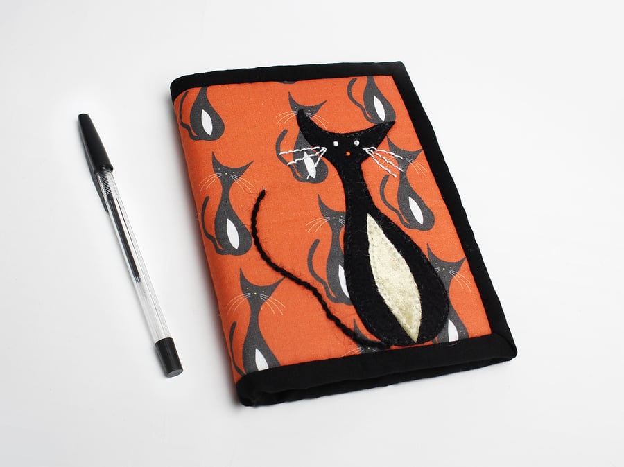 A6 notebook in orange cat print with hand appliquéd cat