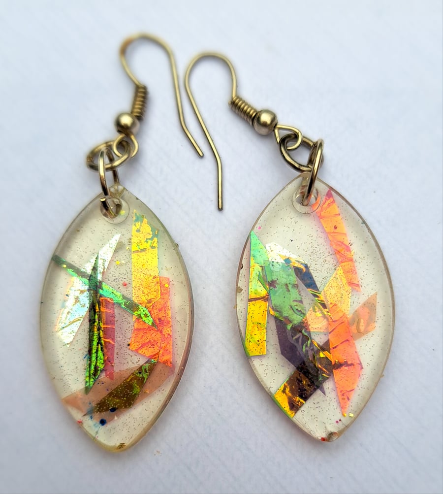 Oval shaped resin earrings with dichroic film