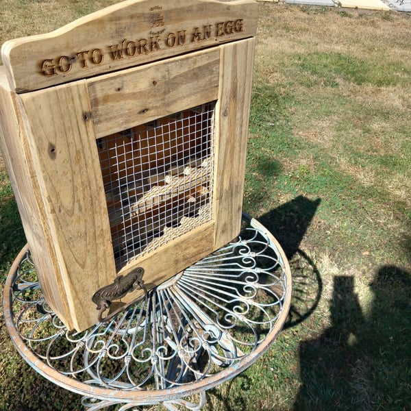 rustic egg cupboard with lion brand logo 