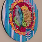 Original round canvas of fish and chips supper with a cup of tea. 