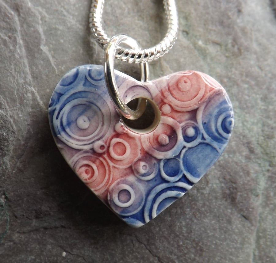 Heart shaped ceramic pendant in pink purple and blue