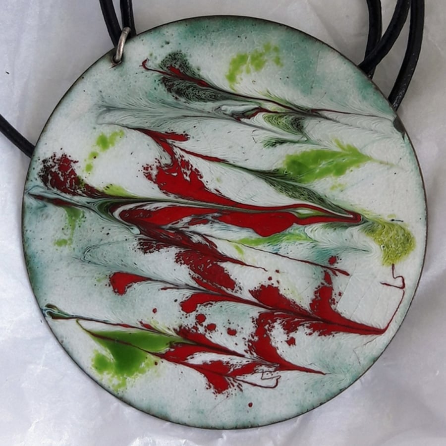 pendant on thong - scrolled green and red on white