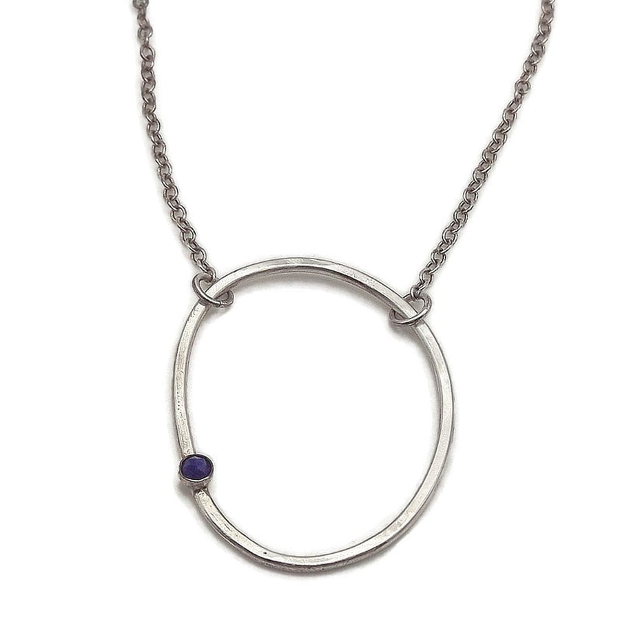 Sterling  silver oval hoop pendant set with rose cut lapis lazuli 