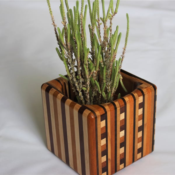 Laminated wooden pot.