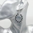 Teardrop pierced hoop earrings black faux pearl glass beads silver spacers.