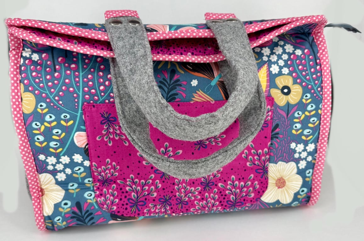 Roomy purple and pink organiser bag with multiple pockets, ideal for creatives