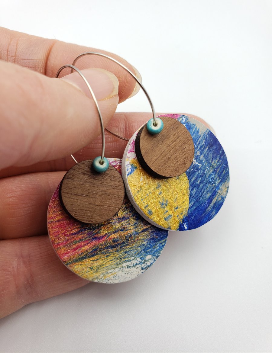 Small unique dangly earrings in a gold, pink, royal blue and grey