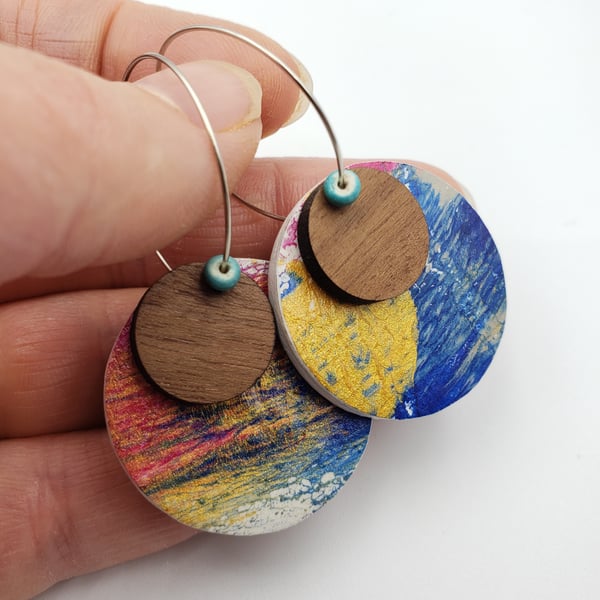 Small unique dangly earrings in a gold, pink, royal blue and grey