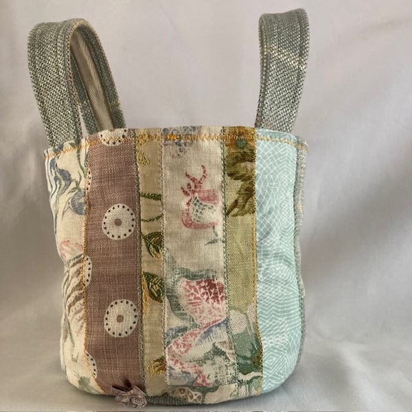 Petite patchwork circular handbag or bucket bag.