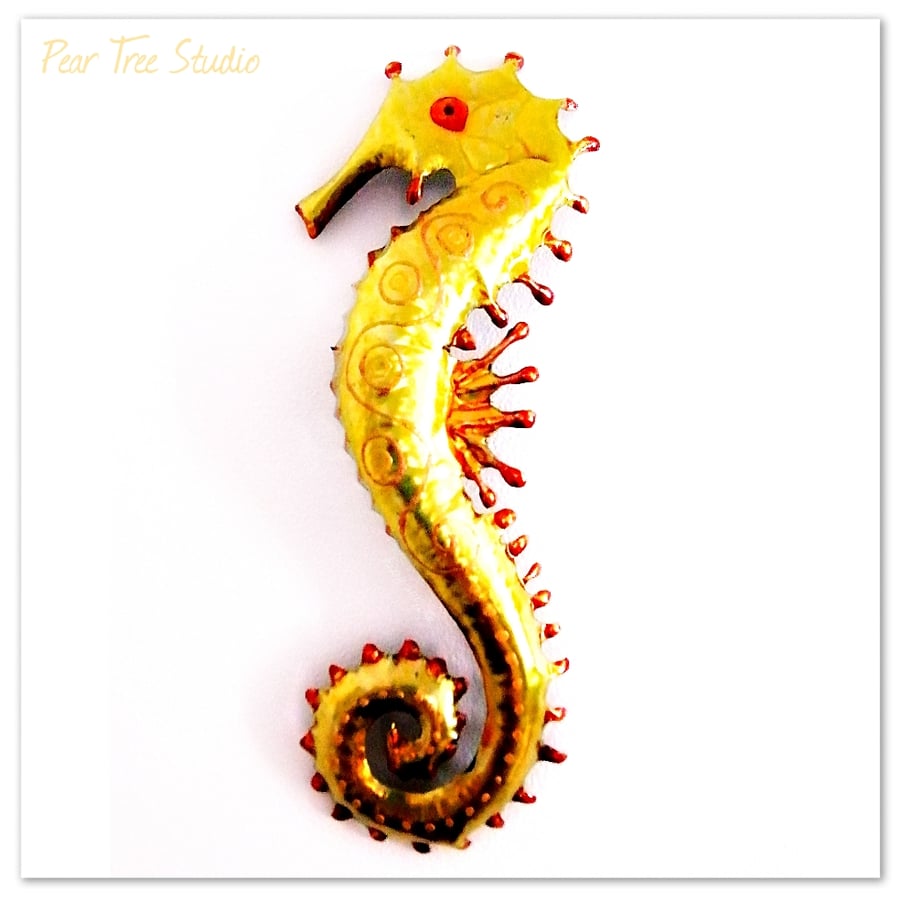 Yellow metal Seahorse wall Decoration. Made from a coffee tin.