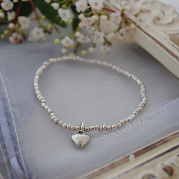 Silver heart and bead stretch bracelet