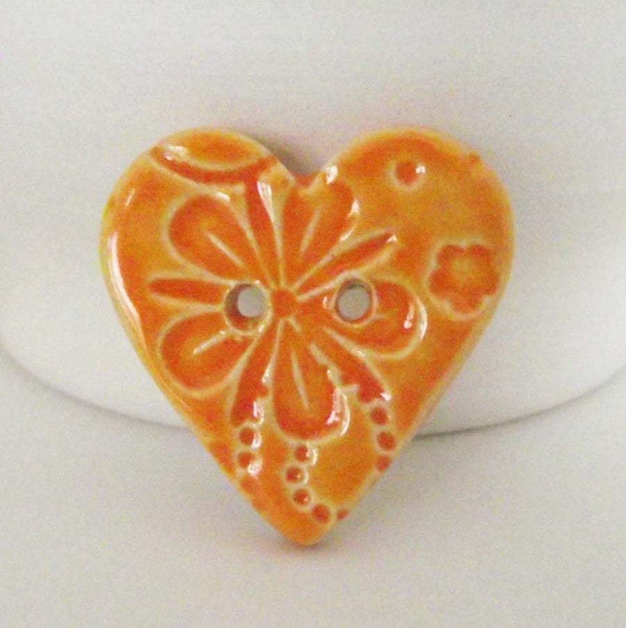 Large orange heart shaped ceramic button