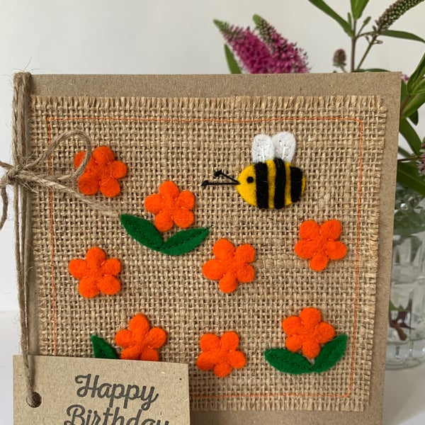 Handmade Birthday Card. Bright orange flowers with a bee from wool felt.