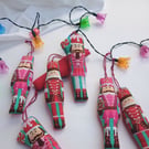 Nutcracker Christmas Decoration - hanging stuffed soldiers in red and pink