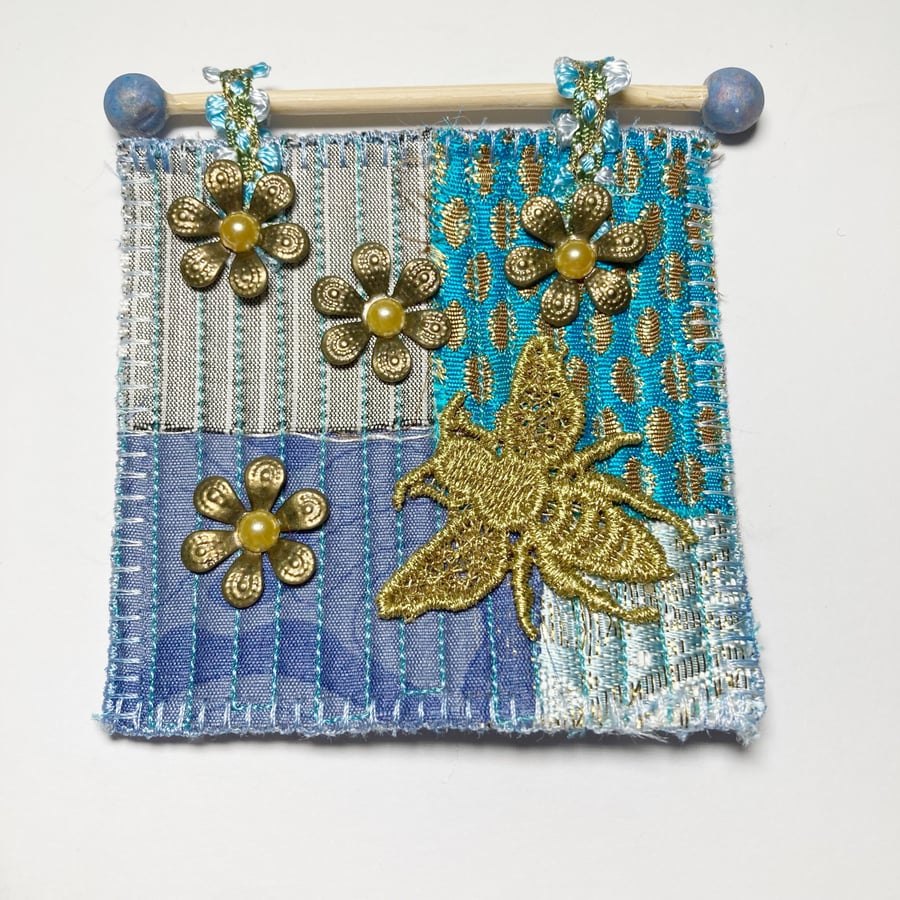 Miniature quilted wall hanging, bee and flowers, blue