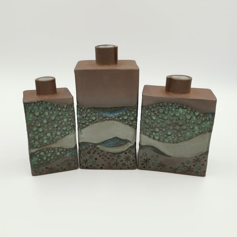 Trio of stoneware bud vases