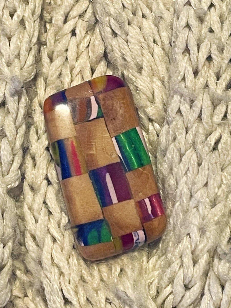 Hand carved resin and plum wood brooch