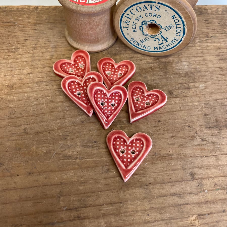 Set of six red handmade ceramic heart buttons