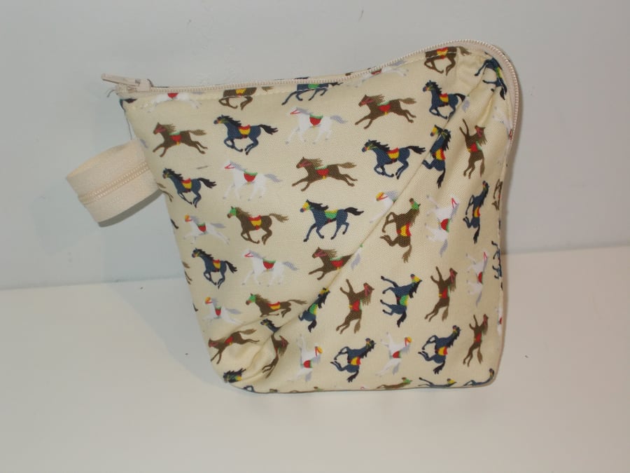 small zipped bag with horse print fabric