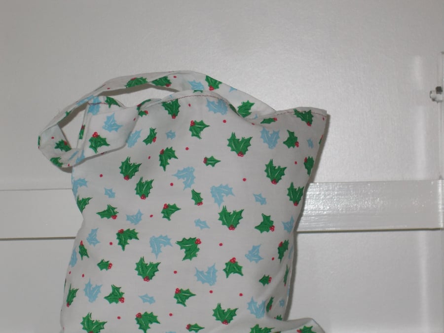 Mini Christmas present bag printed with of holly leaves 