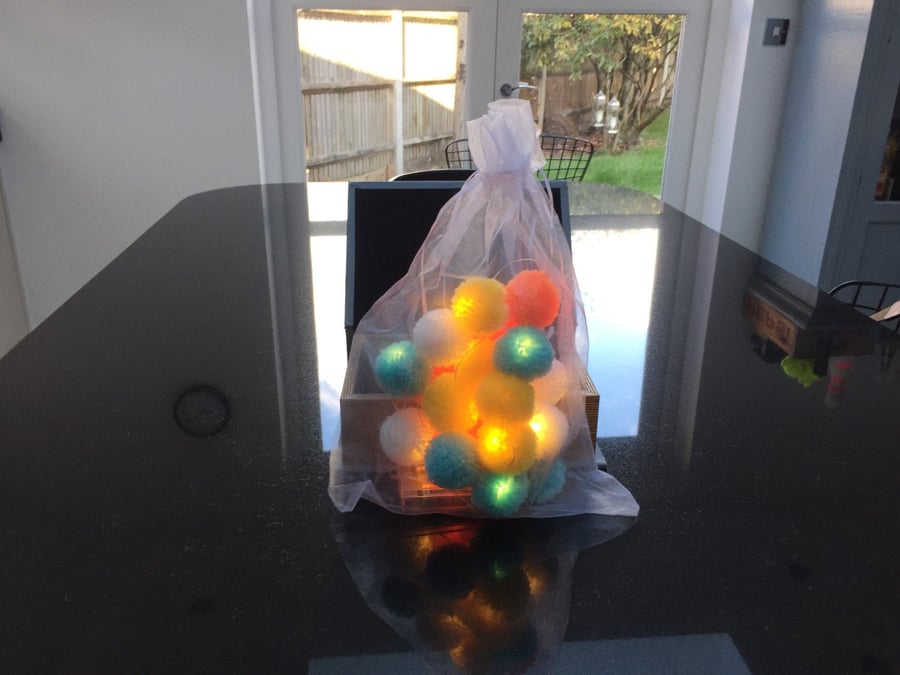 20 pom-pom LED fairy lights in white, yellow neon orange and aqua