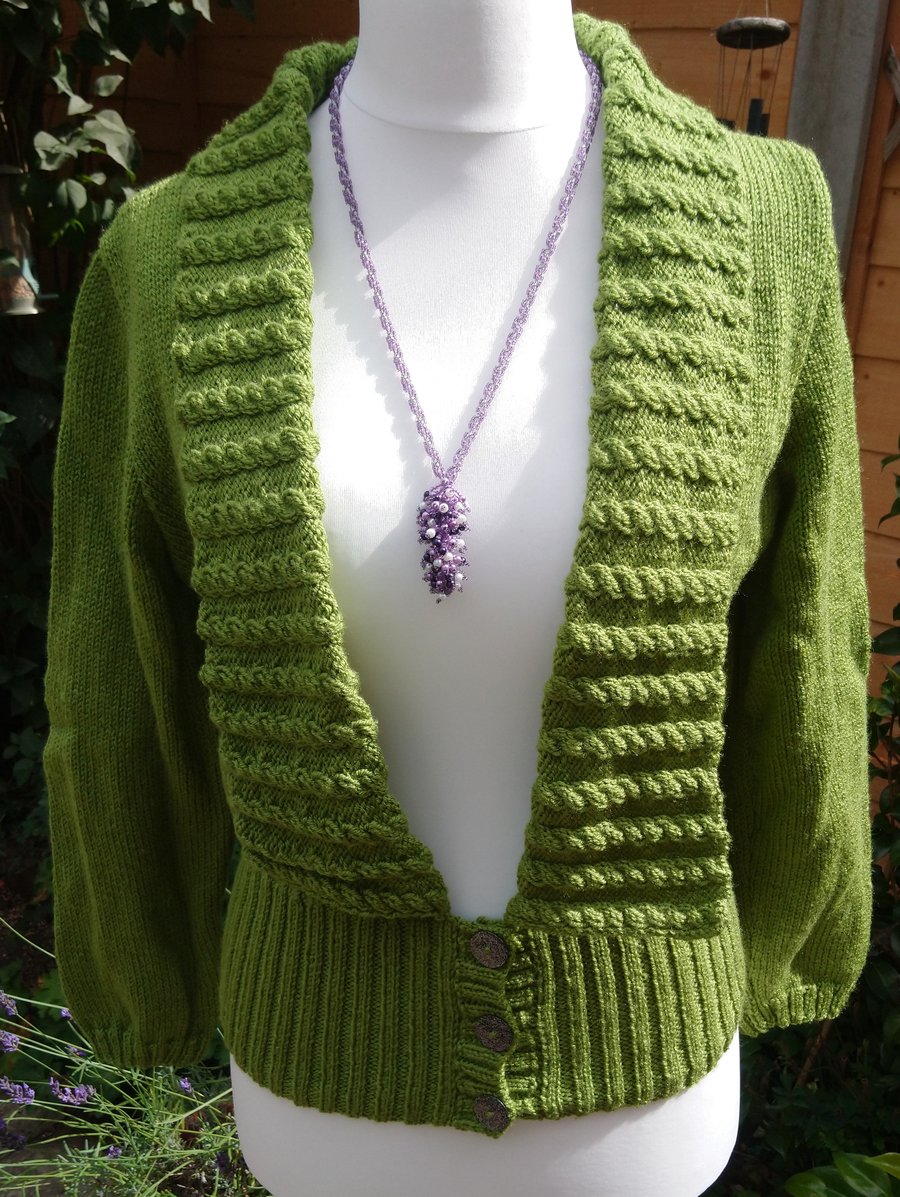 Ladies Hand knitted Green cable twist cardigan with deep ribbed bottom 