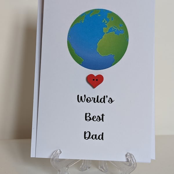 World's Best Dad greetings card with a red heart next to a world