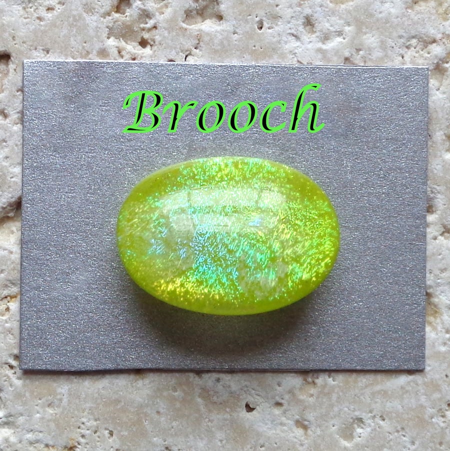 Dichroic lime green fused glass cabochon brooch