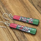 Red and green patterned earrings