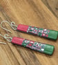 Red and green patterned earrings - Image 1