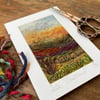 Embroidered wet felting landscape of sunset over Goathland.