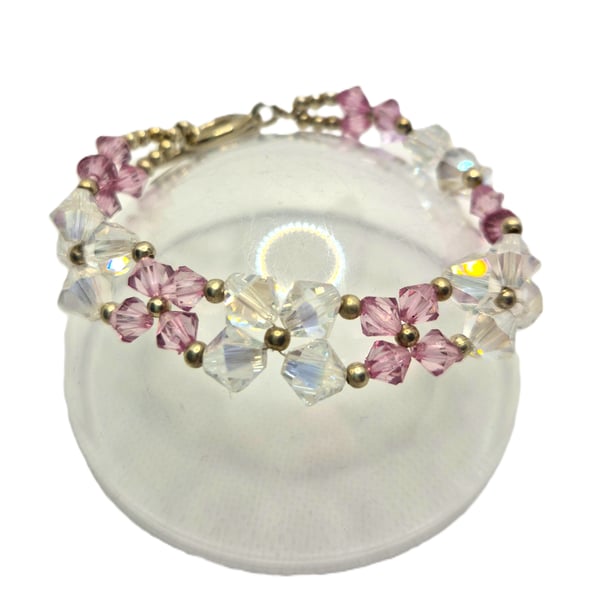 Flower shaped bracelet with clear and pink Swarovski crystals