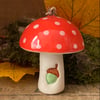 Red ceramic toadstool decoration with acorn detail
