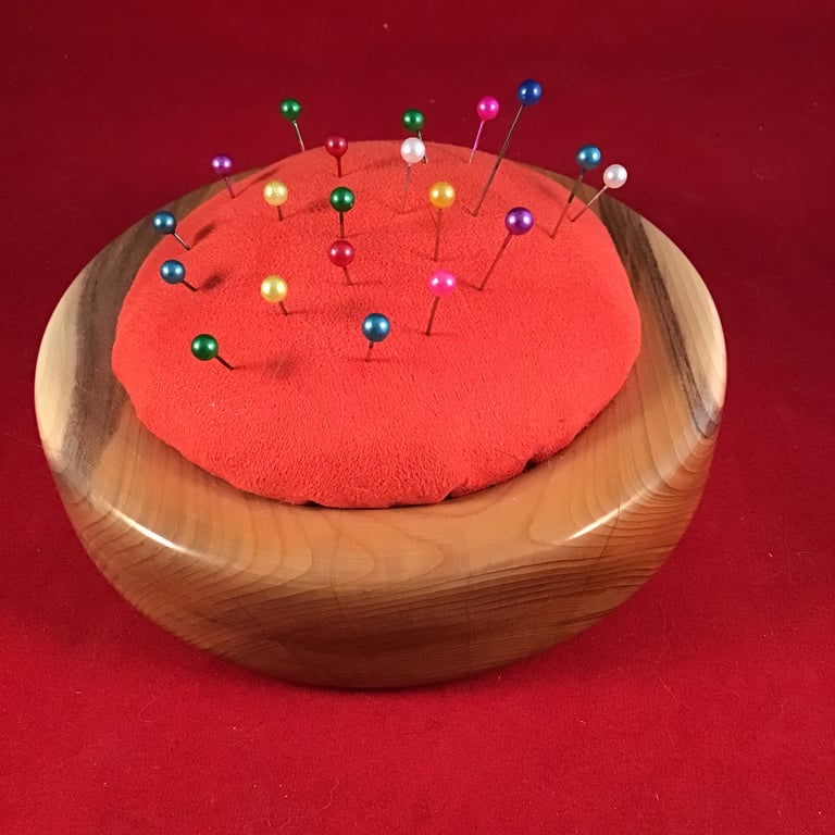 High gloss wood turned pin cushion.
