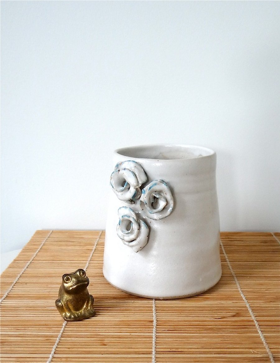 Cream-coloured ceramic vase with roses - handmade pottery