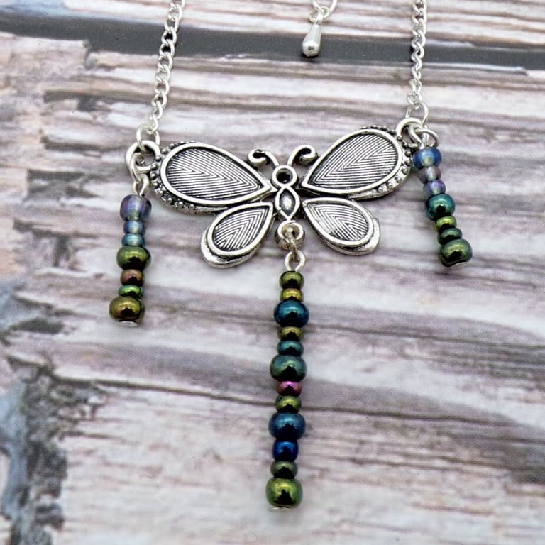 Silver Metal Butterfly Pendant- Metallic Glass Bead Tassels- 18 Inch Adjustable 