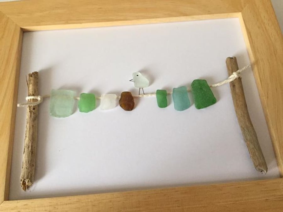 Sea glass washing line and bird picture