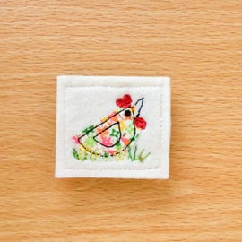 Textile brooch.