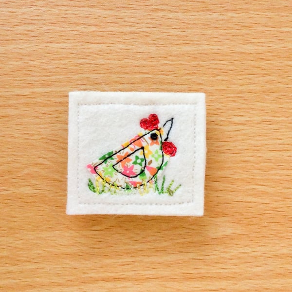 Textile brooch.