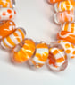 Handmade orange and white patterned lamp work glass beads - Image 4