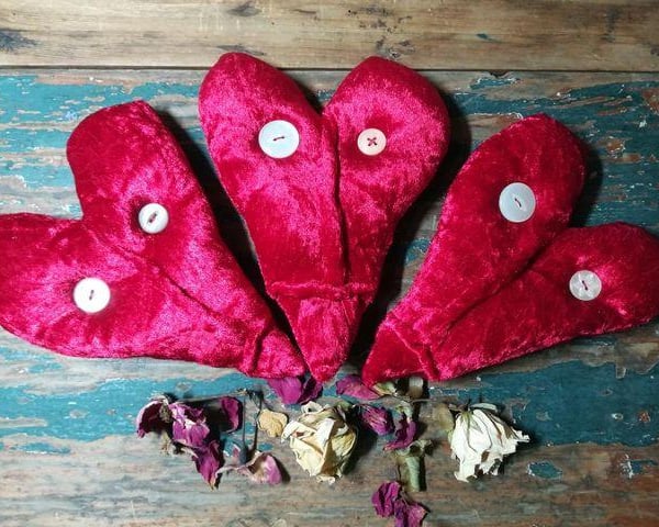 Wall hanging red velvet heart, textile art face, anthropomorphic face