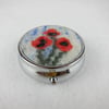 SALE - Round silver tone pill box with poppy decoration