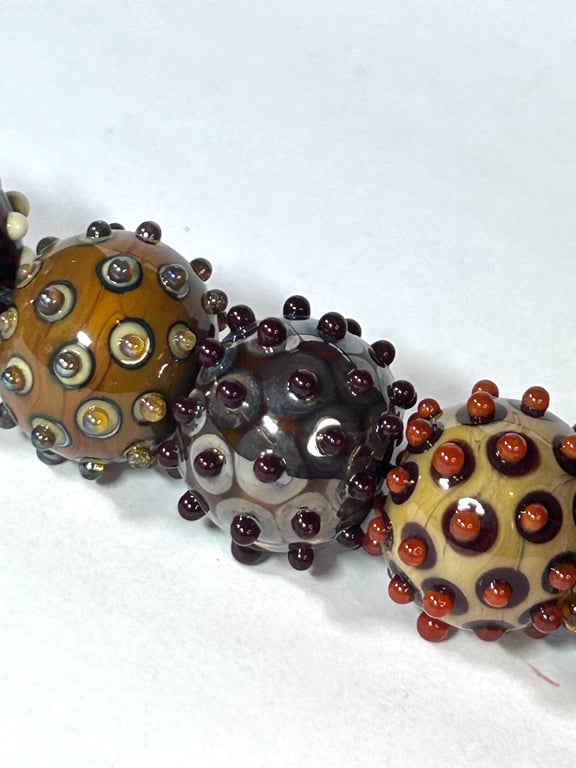 Handmade brown patterned lamp work glass beads