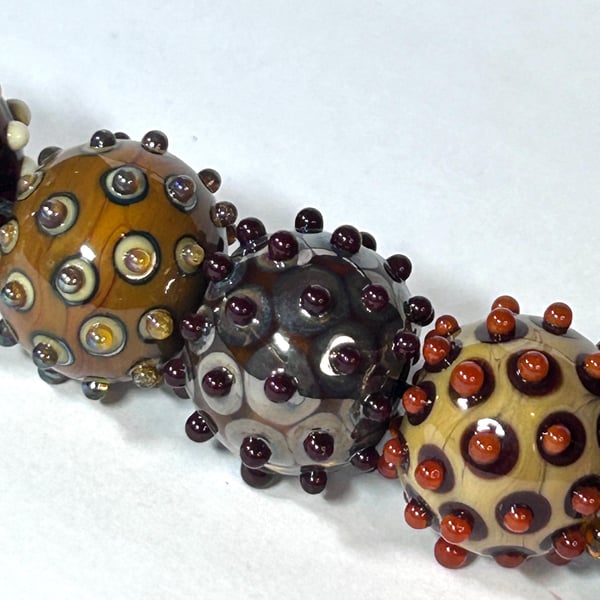 Handmade brown patterned lamp work glass beads