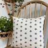 Cushion cover in taupe with navy starfish print, 36cm x 36cm. 
