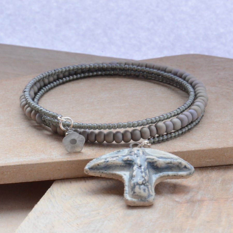 Grey Blue Memory Wire Seed Bead Bracelet with Ceramic Bird 