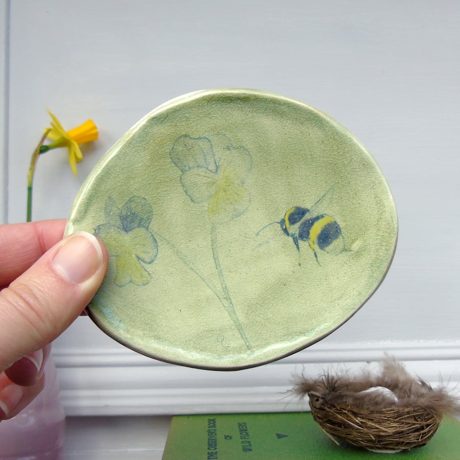 handmade ceramic bee and violas plaque