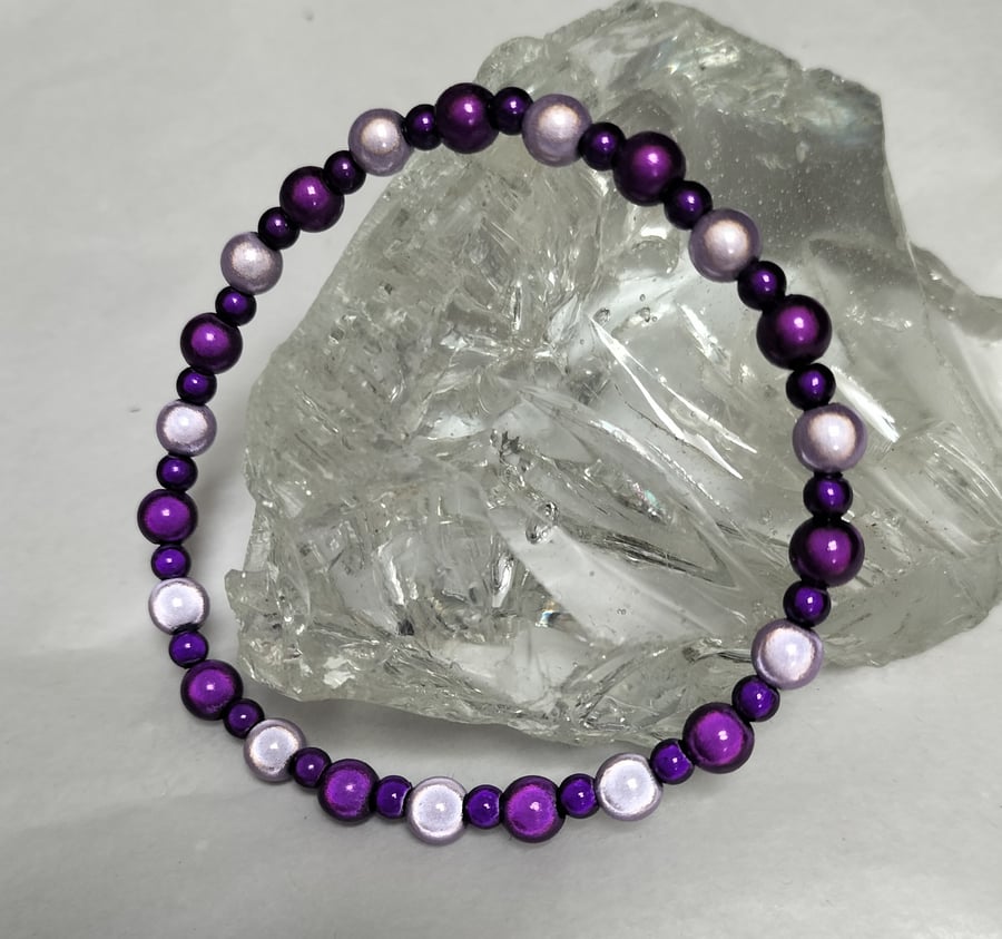 BR469 Purple and mauve miracle bead elasticated bracelet